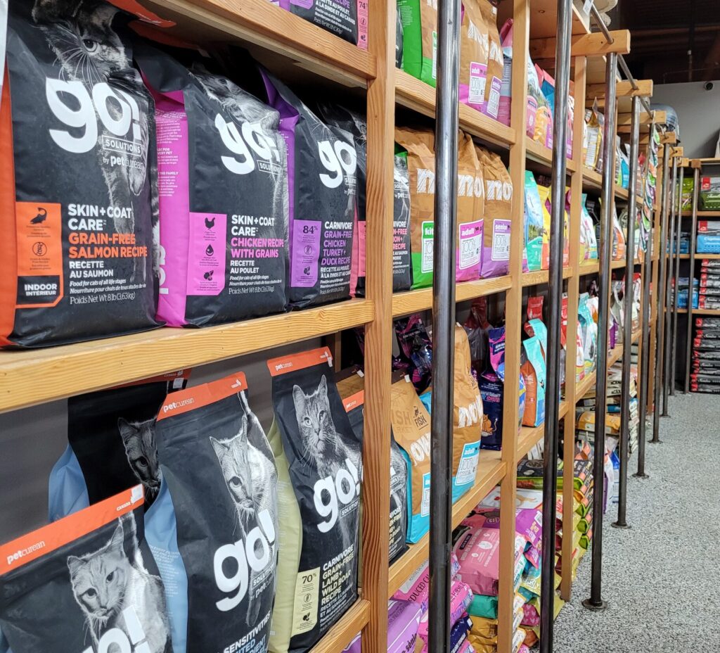 Shows dog food options available at Pet Planet, like Go! Solutions and NOW Fresh by Petcurean.